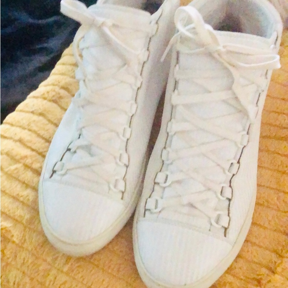 White men Balenciaga high top tennis shoes.